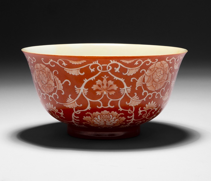 LOT 157 | CORAL-GROUND RESERVE-DECORATED 'LOTUS' BOWL QING DYNASTY, QIANLONG MARK AND OF THE PERIOD | 清乾隆款及年代 珊瑚紅地留白纏枝蓮紋碗 | £8,000 - £12,000 + fees