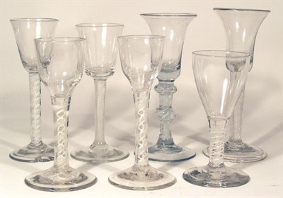 Lot 70 - A group of seven English mid 18th century enamel twist wine glasses