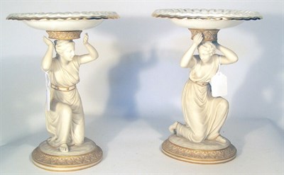 Lot 164 - A pair of bisque and porcelain comports