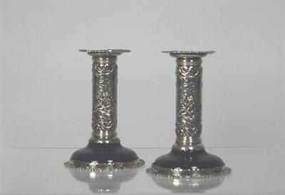 Lot 32 - A pair of late Victorian tortoiseshell desk candlesticks<br/>By William Coymns London 1899
