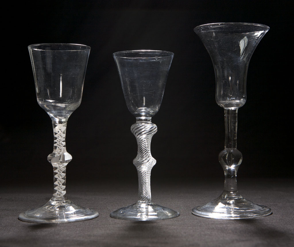 Lot 380 - Three drinking glasses, 18th century one with...
