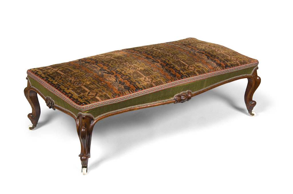 Lot 511 - A Victorian rosewood long footstool, circa...