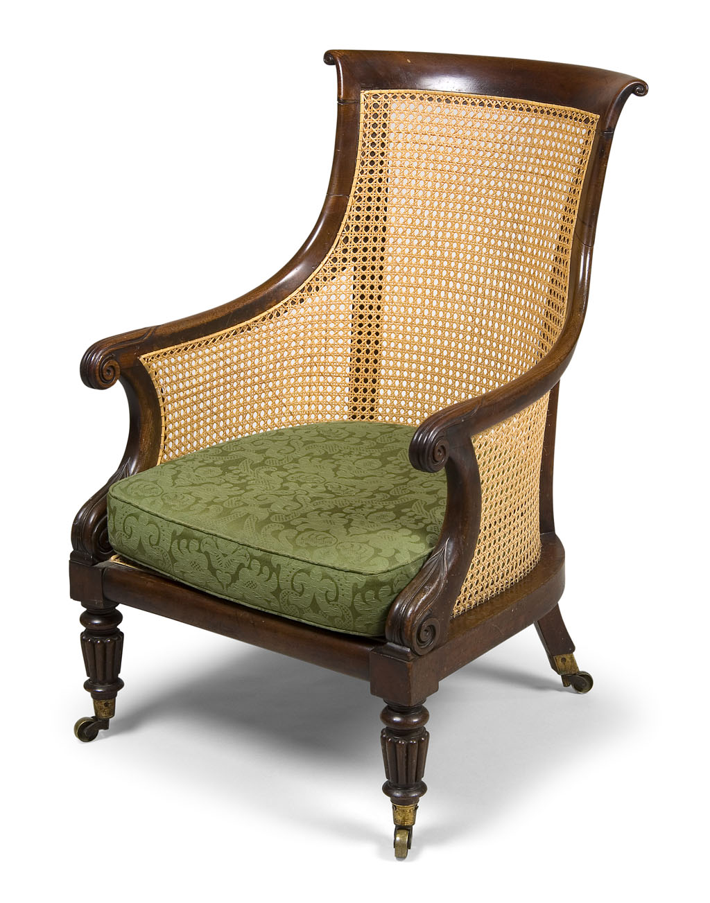 Lot 627 - A George IV mahogany and caned bergere...