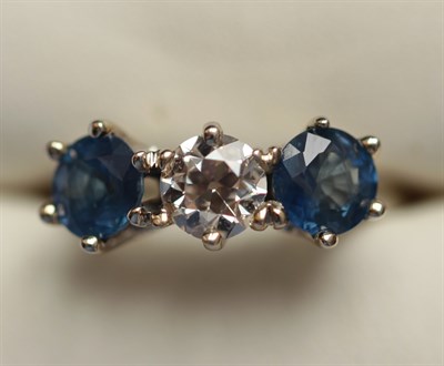 Lot 343 - A sapphire and diamond three-stone ring