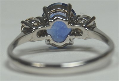 Lot 159 - An 18ct white gold mounted sapphire and diamond three-stone ring