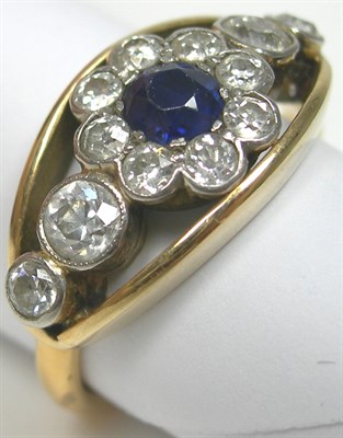 Lot 85 - A 22ct gold mounted sapphire and diamond set cluster ring