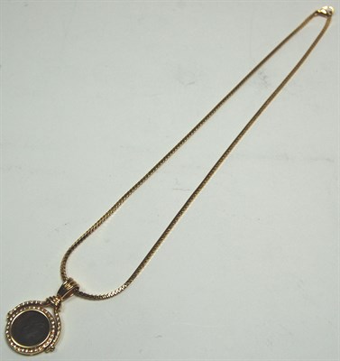 Lot 187 - A modern diamond and coin set pendant with chain