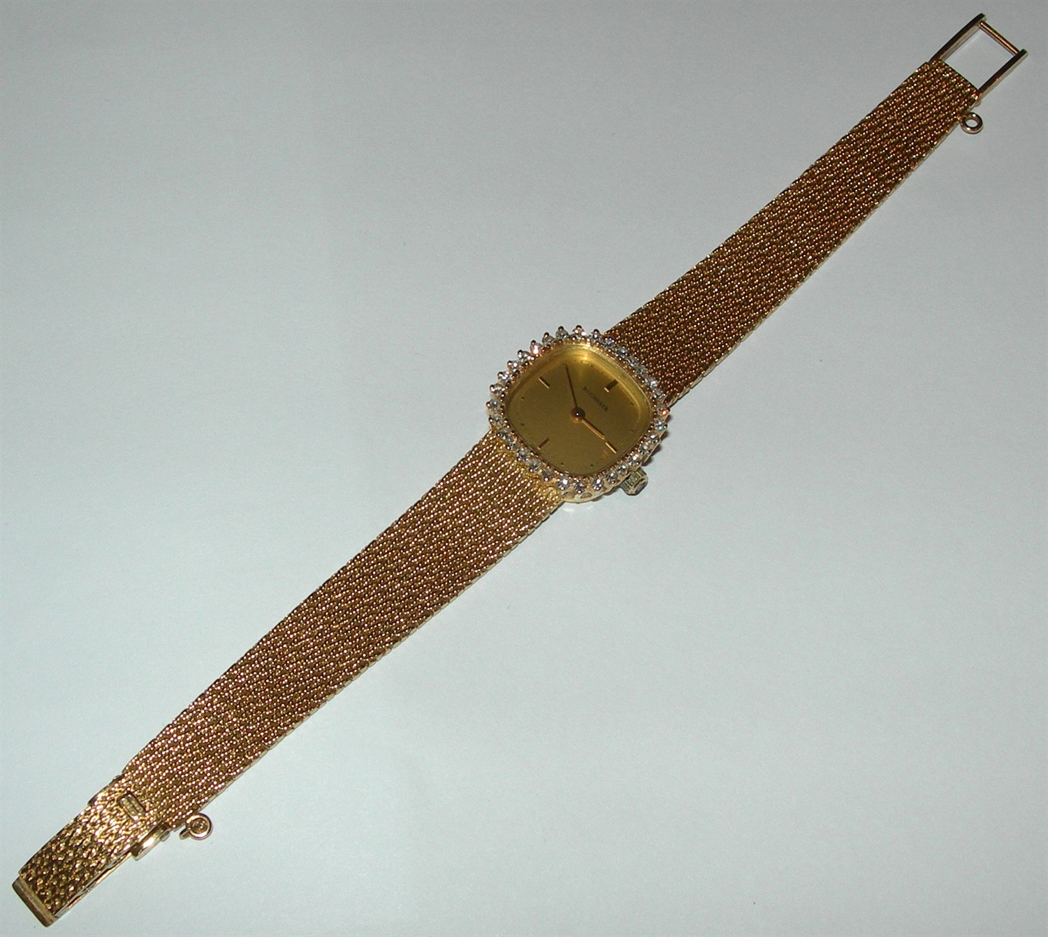 Lot 177 - BUCHERER - a lady's French gold diamond set wrist watch