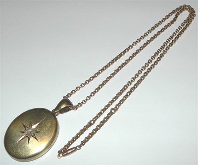 Lot 43 - A Victorian diamond set locket with chain