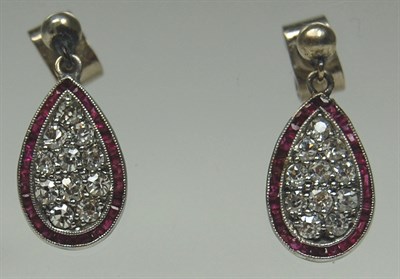 Lot 138 - A pair of ruby and diamond pendant earrings