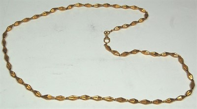 Lot 35 - An Eastern gold fancy link chain