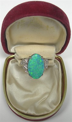 Lot 117 - A black opal doublet and diamond set ring