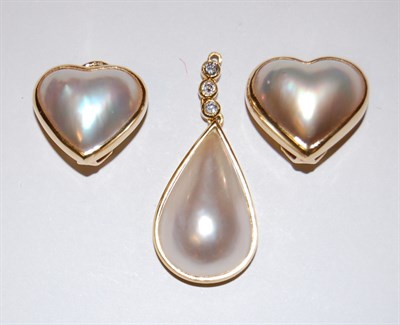 Lot 36 - A pair of 18ct gold mabe pearl earrings and a similar pendant