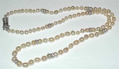 Lot 80 - A small pearl and diamond necklace
