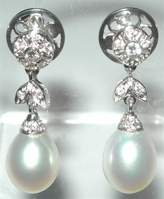 Lot 87 - A pair of pearl and diamond pendant earrings