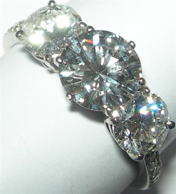 Lot 89 - A modern three-stone diamond ring