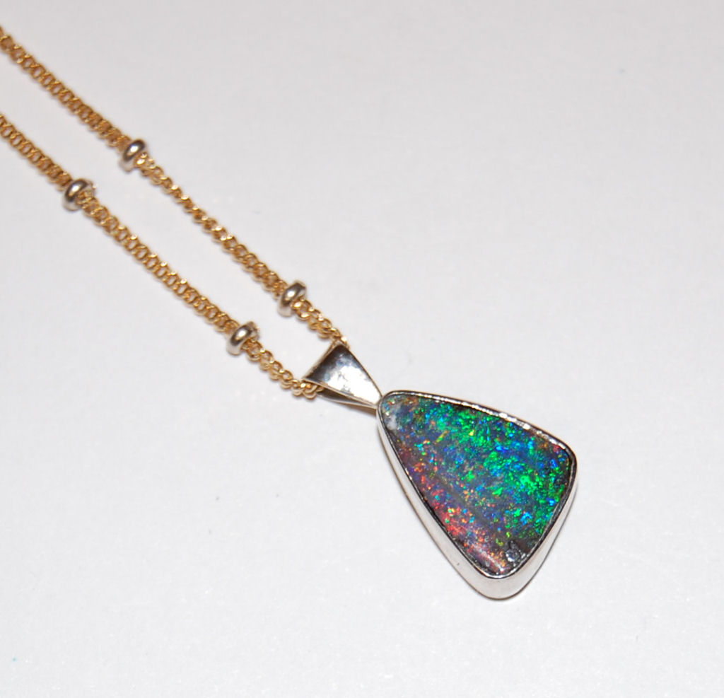 Lot 75 - An 18ct gold mounted boulder Opal pendant