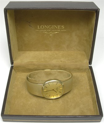 Lot 15 - LONGINES - a gentleman's 15ct gold wrist watch