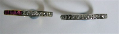 Lot 88 - A ruby and diamond full eternity ring