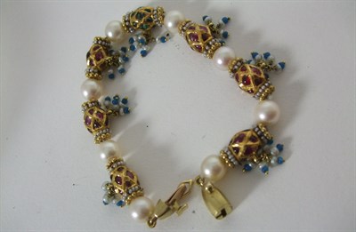 Lot 41 - An Indian multi gem set 18ct gold and pearl bracelet