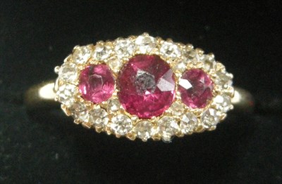 Lot 80 - An attractive 18ct gold, ruby and diamond ring