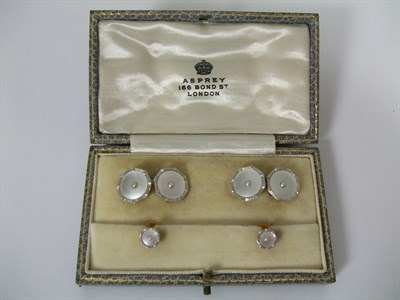 Lot 38 - A cased Art Deco mother of pearl and seed pearl cufflinks and stud set