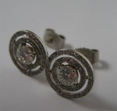 Lot 51 - A pair of all diamond cluster earrings
