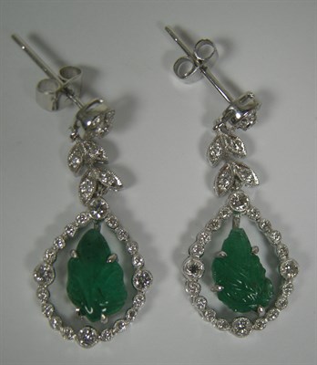 Lot 63 - A pair of Belle Époque style emerald and diamond pendant earrings