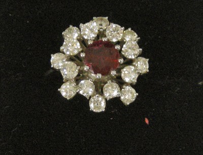 Lot 19 - An 18ct white gold ruby and diamond cluster ring