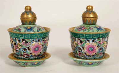 Lot 64 - PAIR OF FAMILLE ROSE ROTATING AND RETICULATED SNUFF BOTTLES
