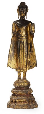 Lot 141 - SOUTH EAST ASIAN GILDED BRONZE STANDING BUDDHA