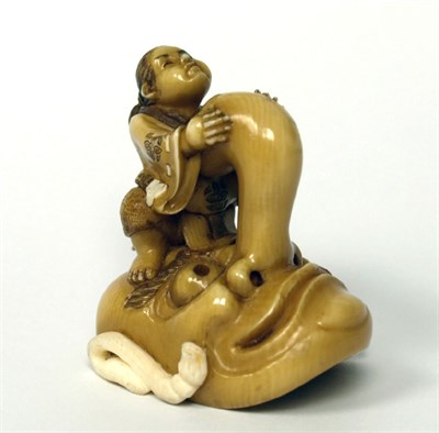 Lot 153 - JAPANESE CARVED AND STAINED NETSUKE