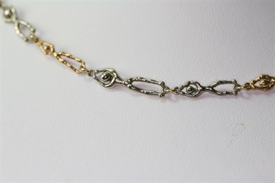 Lot 146 - STUART DEVLIN - a 1970's 18ct two-coloured gold fancy link necklace
