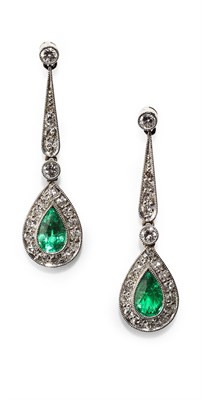 Lot 104 - A pair of emerald and diamond set pendant earrings