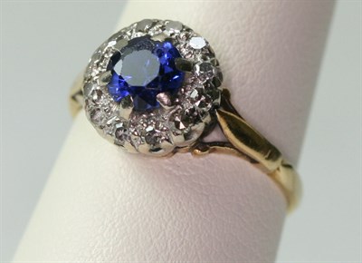 Lot 107 - A sapphire and diamond circular cluster ring