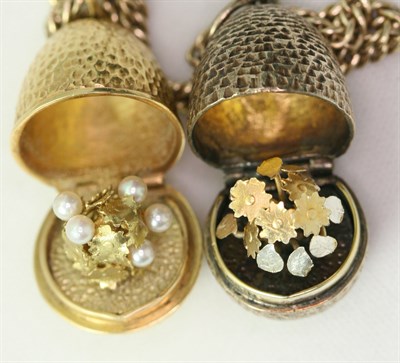 Lot 120 - STUART DEVLIN - two 1970's ovoid lockets with chain