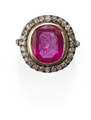 Lot 109 - A seal carved ruby and diamond set cluster ring