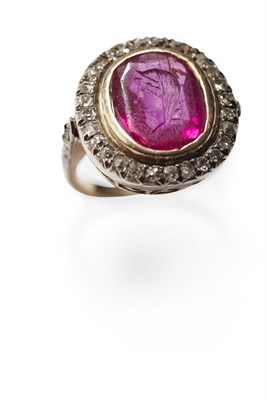 Lot 109 - A seal carved ruby and diamond set cluster ring
