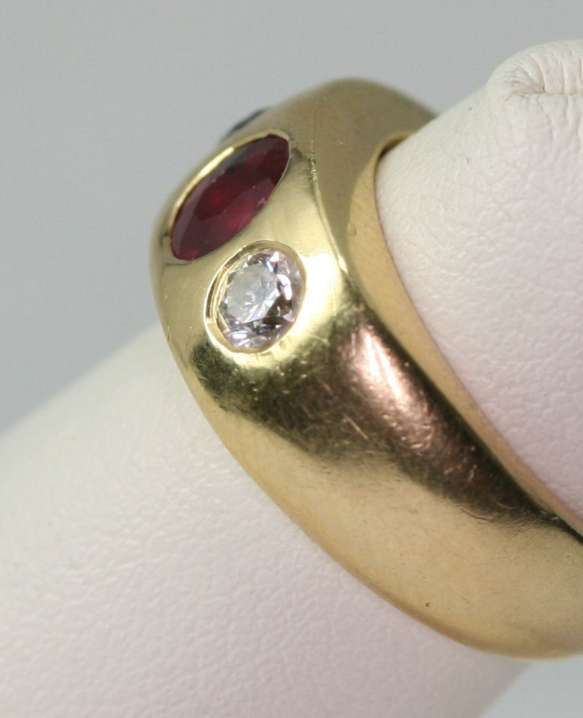 Lot 88 - A ruby and diamond three-stone ring