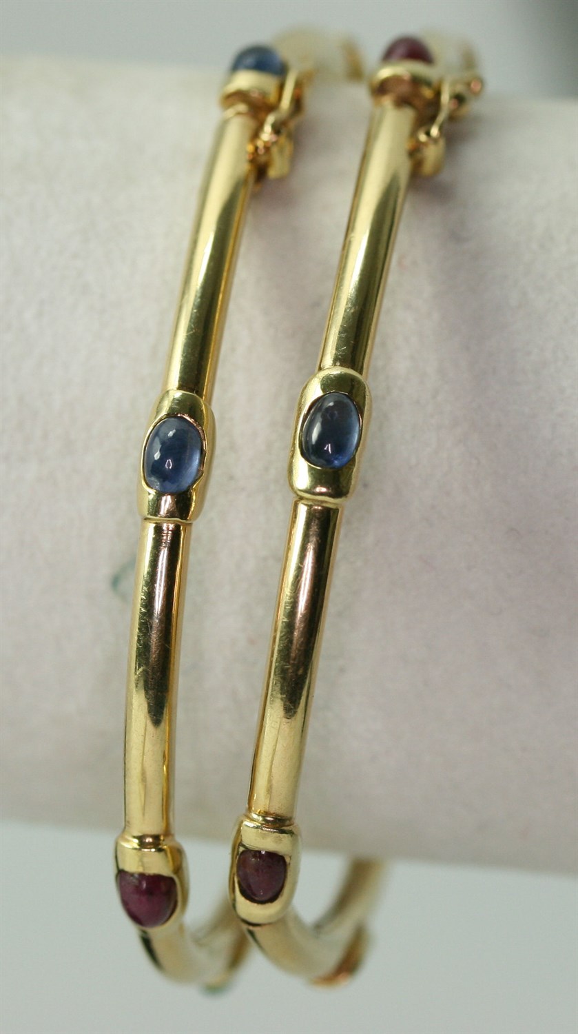 Lot 131 - A pair of multi-gem set bracelets