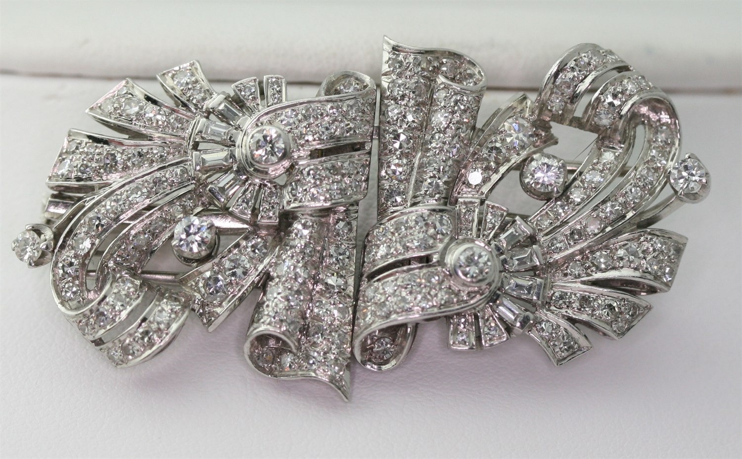 Lot 45 - An early 20th century pair of diamond set clips