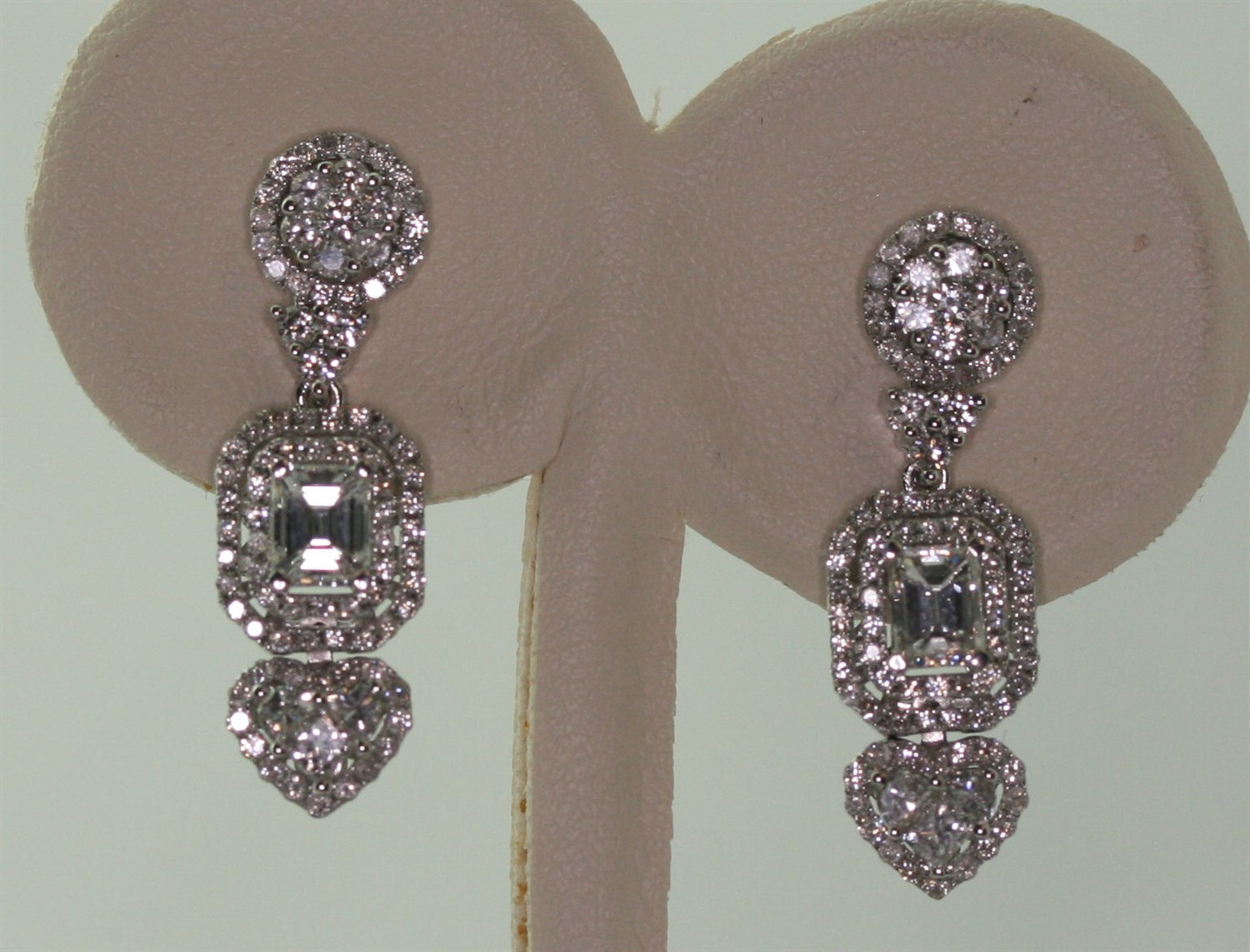 Lot 69 - A pair of diamond set pendant earrings