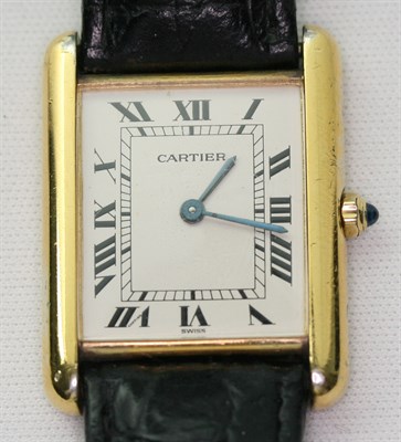 Lot 202 - CARTIER - a gold plated silver Tank wrist watch