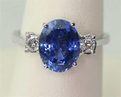 Lot 158 - An 18ct white gold mounted sapphire and diamond set three-stone ring