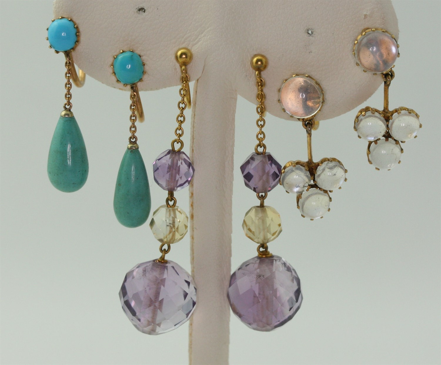 Lot 24 - Four pairs of gem set pendant earrings