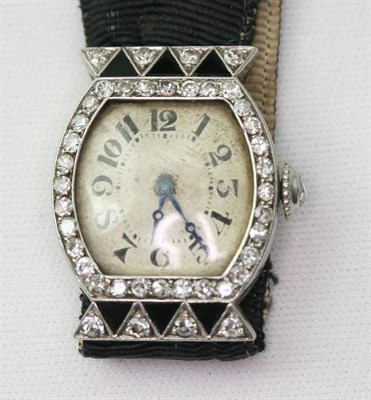 Lot 197 - An Art Deco onyx and diamond set cocktail watch