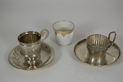 Lot 245 - Two Russian silver tea glass holders and saucers