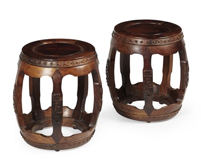 Lot 39 - PAIR OF CHINESE HUANG HUALI CARVED BARREL FORM STOOLS