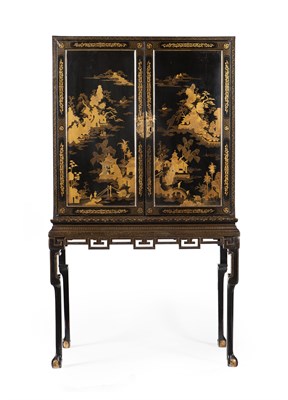Lot 18 - CHINESE BLACK LACQUER AND GILT CABINET ON STAND