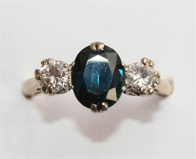 Lot 326 - A sapphire and diamond three stone ring